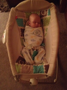 Baby Ian snuggled up in his sleep sack.